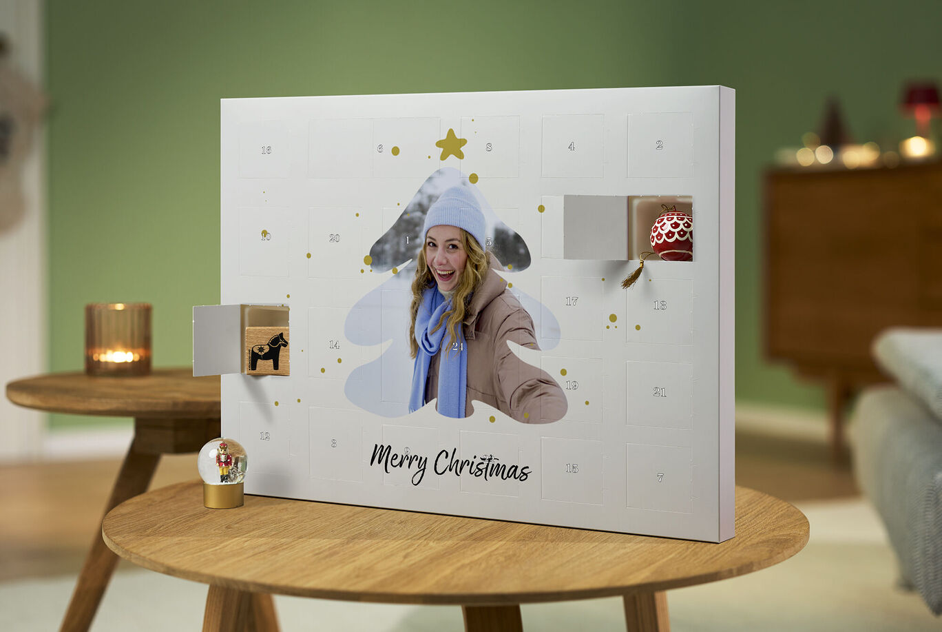 A wonderful Advent calendar with Christmas tree decor and gifts.